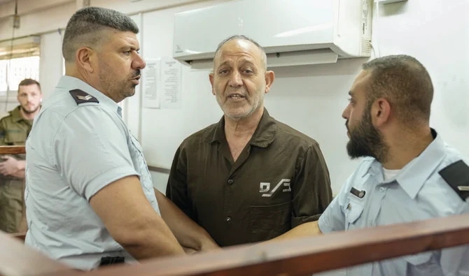 Palestinian prisoner Bassam Al-Saadi appears in a courtroom for Sunday’s hearing at the Israeli Ofer military base near the West Bank city of Ramallah. (AP)