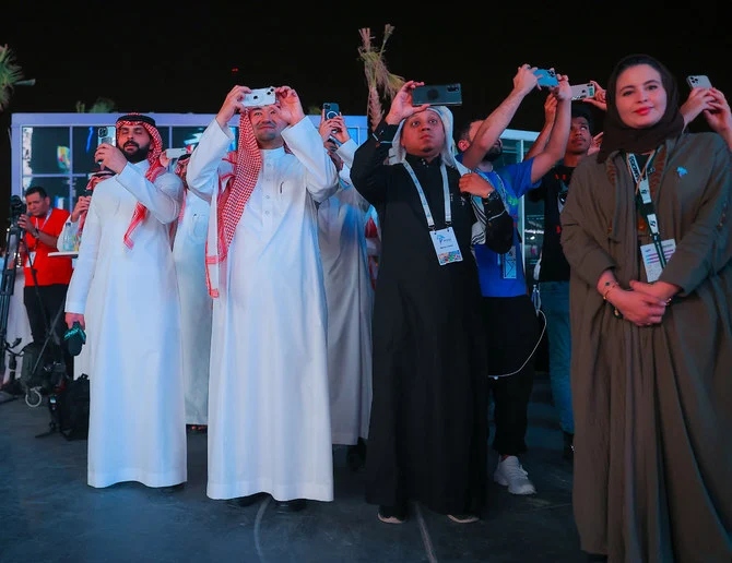 Manga Productions CEO Essam Bukhary and members of the media watch as a synchronized drone display, in the form of ‘Grendizer’ characters, lit up the sky over Riyadh on Thursday. (Photo by Saad Aldosari)