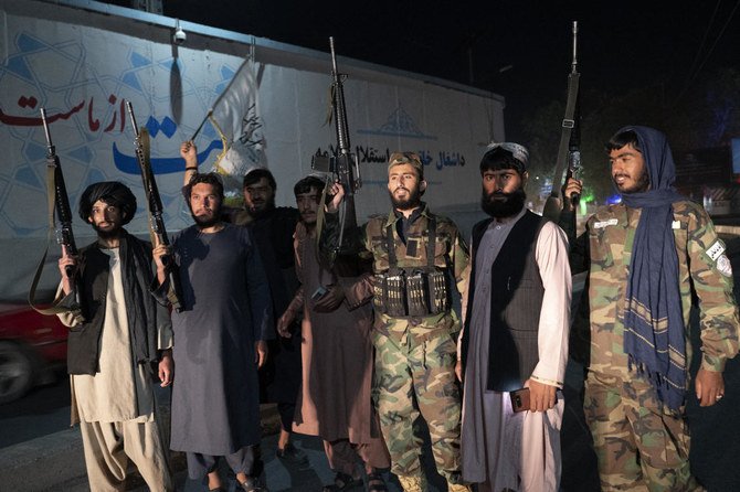 Taliban fighters gather in the streets of Kabul as they celebrate the first anniversary of US troops withdrawal from Afghanistan, near the former US embassy in Kabul. (File/AFP)