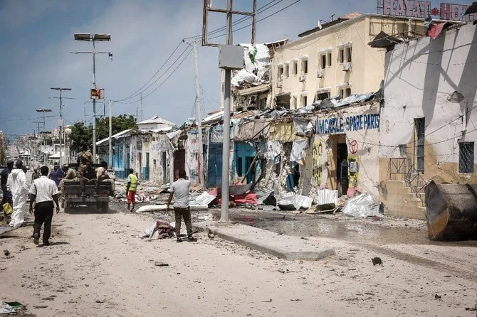 People watch outside of destroyed Hayat Hotel after a deadly 30-hour siege by Al-Shabaab jihadists in Mogadishu. (File/AFP)