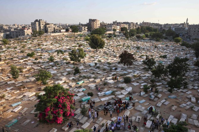 Palestinians take part in a protest at the northern Gaza Strip’s Falluja cemetery in Jabalia, on August 16, 2022. (AFP)