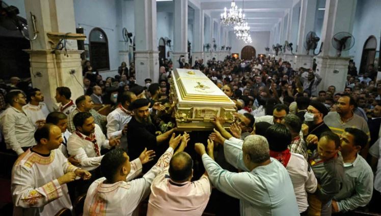 Egyptian mourners attend the funeral of victims killed in Cairo Coptic church fire, at the church of the Blessed Virgin Mary in the Giza Governorate on August 14, 2022. (AFP)