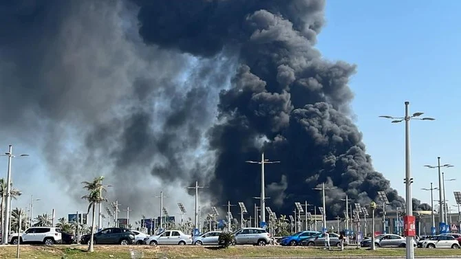 Black smoke billows from the Carrefour hypermarket in Muharram Bek, Alexandria. (Twitter Photo)