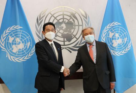 This handout picture taken on August 1, 2022 and released by the Prime Minister's office of Japan via Jiji Press on August 2 shows Japanese Prime Minister Fumio Kishida (left) shaking hands with United Nations Secretary General Antonio Guterres at a meeting in New York. (AFP)