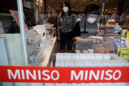 Customers shop at a store of Chinese retailer Miniso Group in Beijing, China September 13, 2021. (Reuters/file)