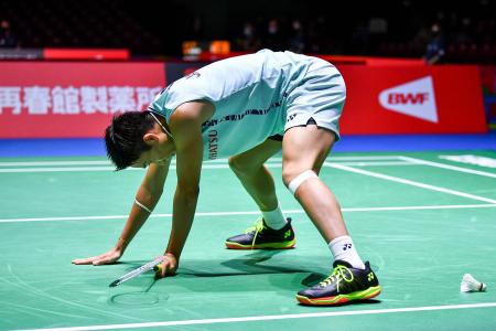 Japan's Kento Momota reacts after losing a point during the men's singles match against India's Prannoy H.S. on day three of the Badminton World Championships in Tokyo on August 24, 2022. (AFP)