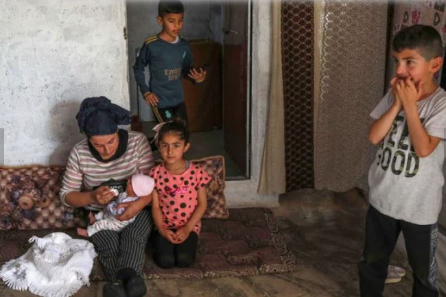 Displaced Iraqis from the Yazidi community are pictured at camp for internally displaced persons in the city of Zakho, Iraq, on May 5, 2022. (AFP)