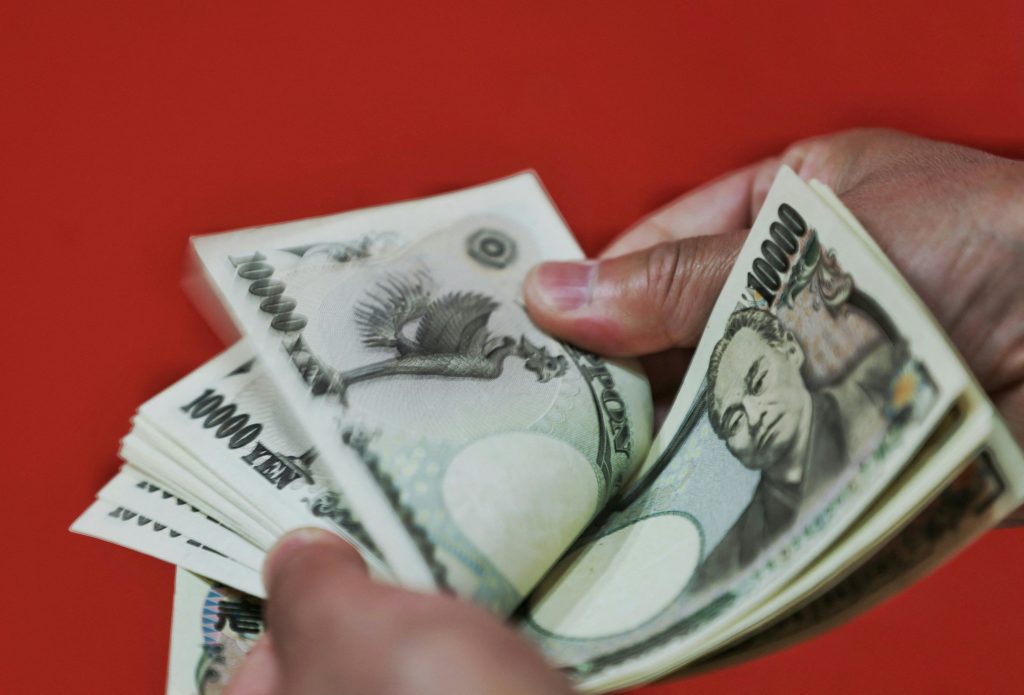 The Japanese yen held above 24-year lows against the U.S. dollar on Thursday. (AFP)