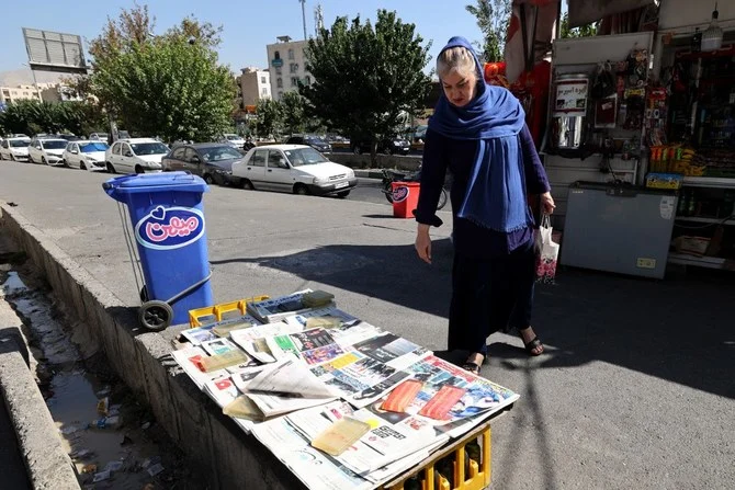 Mahsa Amini, who died while detained by Iran’s morality police, was featured in newspaper headlines. (AFP)