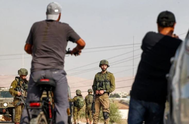 The policy imposes rules on foreigners who marry Palestinians or who come to the West Bank to work, volunteer, study or teach, but the rules don't apply to Israel's visitors. (AFP)