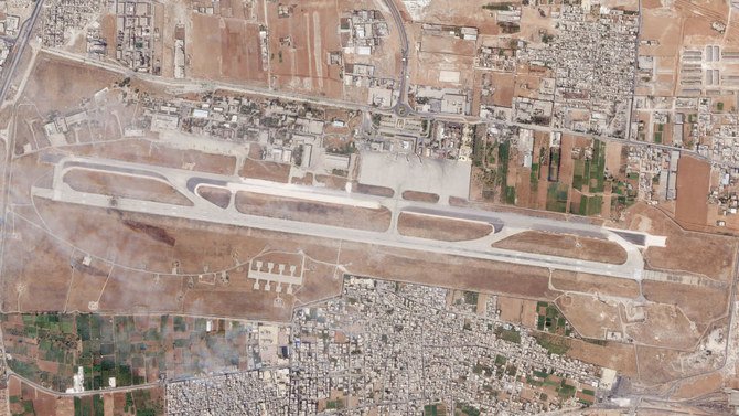 An Israeli attack targeting Aleppo International Airport tore a hole in the runway and damaged a structure close to the military side of the airfield. (Planet Labs PBC via AP)