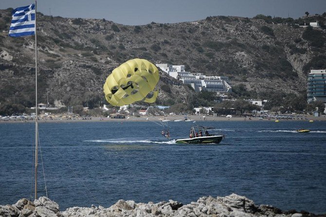 Tourists enjoy watersports at Faliraki Bay in the Aegean island of Rhodes. (File/AFP)