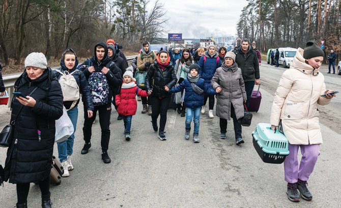 Ukrainian refugees being evacuated from Irpin to Kyiv after Russian forces invaded Ukraine. (Shutterstock)
