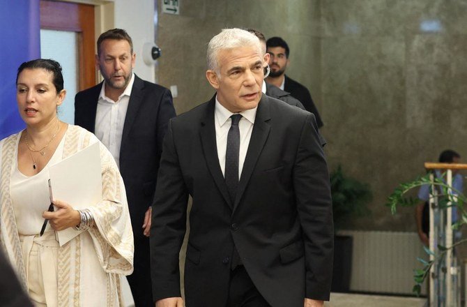 Israeli Prime Minister Yair Lapid arrives to attend a cabinet meeting, Jerusalem, Sept. 4, 2022. (AFP)