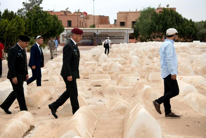 Israeli military chief of staff Aviv Kohavi (C) visits the Jewish cemetery in Marrakesh on July 20, 2022. Israel and Morocco established ties under a peace deal brokered by the US. (AFP)