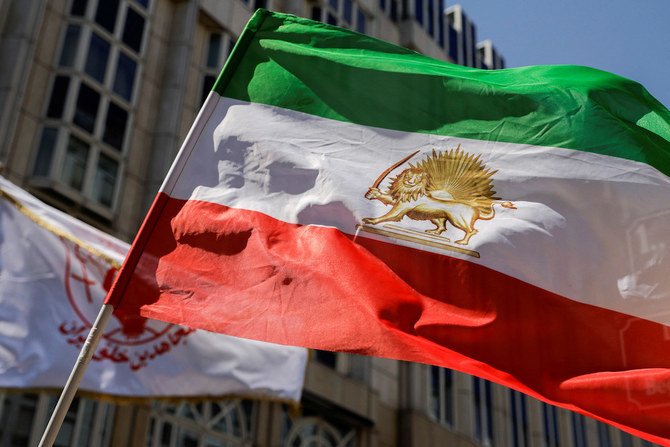 A flag is waved in front of Palais Coburg where closed-door nuclear talks with Iran take place in Vienna, Austria, Aug. 4,2022. (Reuters/File)