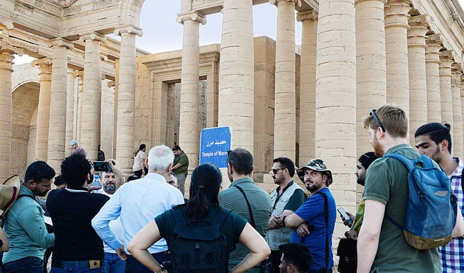 Some 40 visitors, most of them Iraqis, were allowed to walk around the more than 2,000-year-old archaeological site in the golden hour of twilight. (AFP)