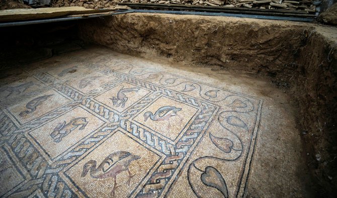 Details of parts of a Byzantine-era mosaic floor are uncovered by a Palestinian farmer in Bureij in central Gaza Strip, Sept. 5, 2022. (AFP)