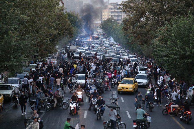 Iranian demonstrators taking to the streets of the capital Tehran during a protest for Mahsa Amini, days after she died in police custody. (AFP)