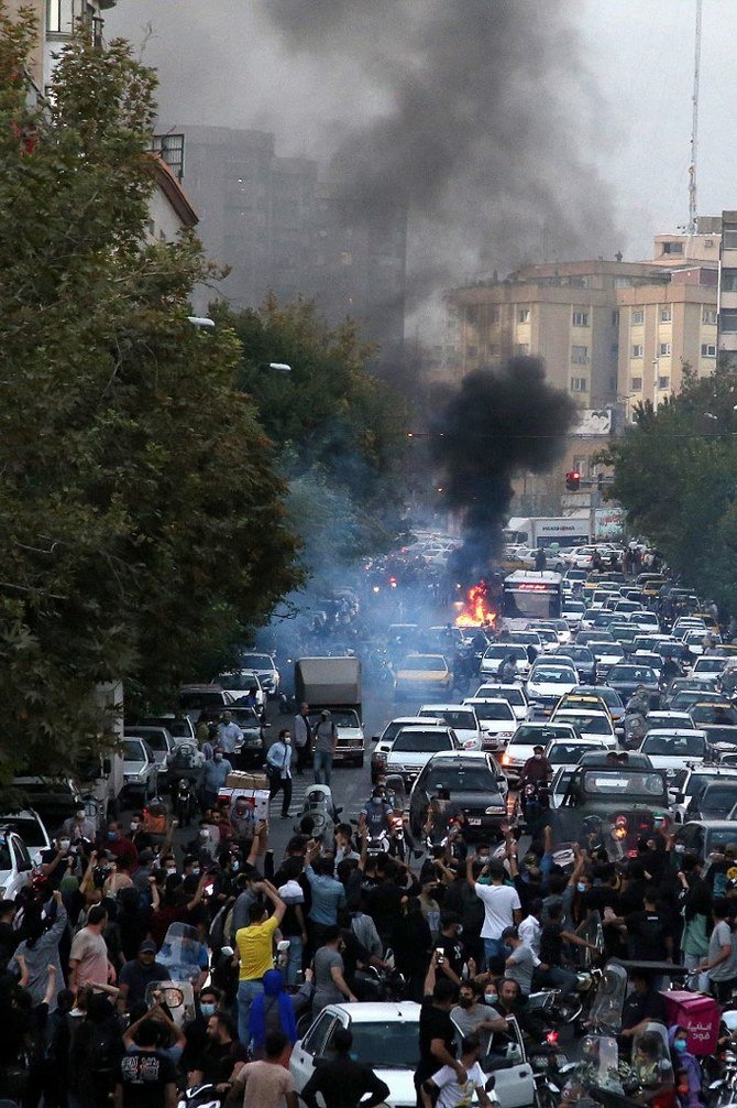 Iranian demonstrators taking to the streets of the capital Tehran during a protest for Mahsa Amini, days after she died in police custody. (AFP)