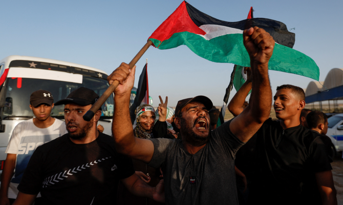 Palestinians take part in an anti-Israel rally over tension in Jerusalem’s Al-Aqsa mosque, near the Israel-Gaza border fence in Gaza City September 26, 2022. (Reuters)