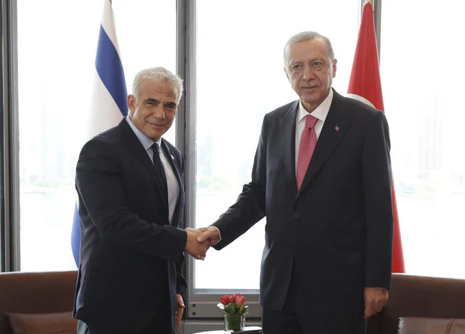 Turkey’s President Recep Tayyip Erdogan, right, shakes hands with Israeli Prime Minister Yair Lapid during their meeting on the sidelines of the United Nations General Assembly in New York. (Turkish Presidency via AP)