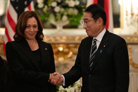 US Vice President Kamala Harris (left) and Japan's Prime Minister Fumio Kishida (right) shake hands prior to the Japan-USA bilateral meeting at the Akasaka Palace state guest house in Tokyo on September 26, 2022. (AFP)