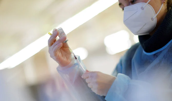 A nurse prepares a booster dose of the Moderna COVID-19 vaccine. (Reuters)