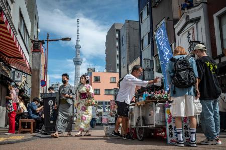People visit the Asakusa area, a popular tourist location, in Tokyo on September 13, 2022. (AFP)