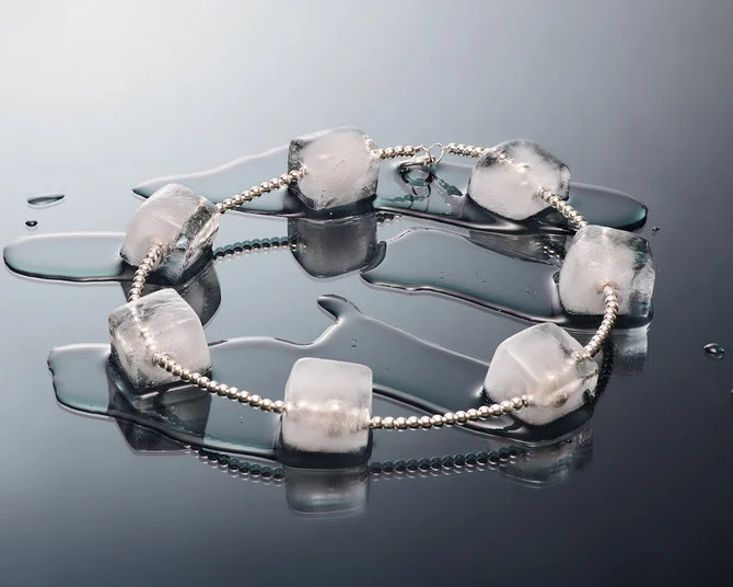 The OoOoooOoooOh la l’ice necklace features a string of silver beads with seven ice cubes frozen onto it. (Supplied)