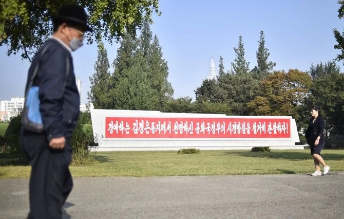 A banner advises North Koreans to adhere to the polices of Kim Jong Un, Pyongyang, North Korea, Sept. 30, 2022. (AFP)