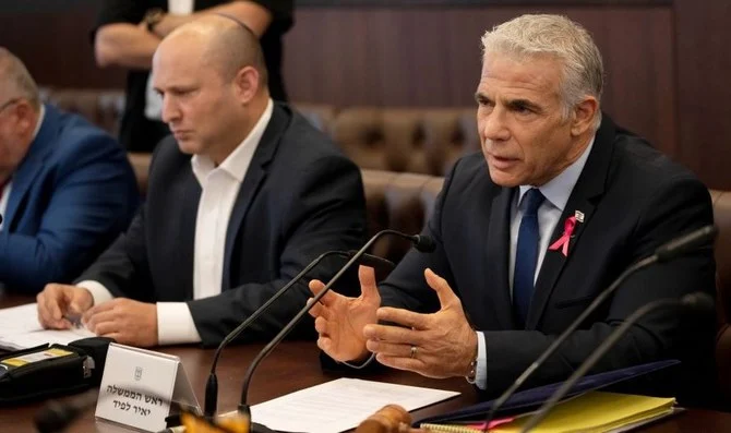 Israeli PM Yair Lapid makes an opening statement as he chairs the weekly cabinet meeting in Jerusalem, Oct. 2, 2022. (AP Photo)