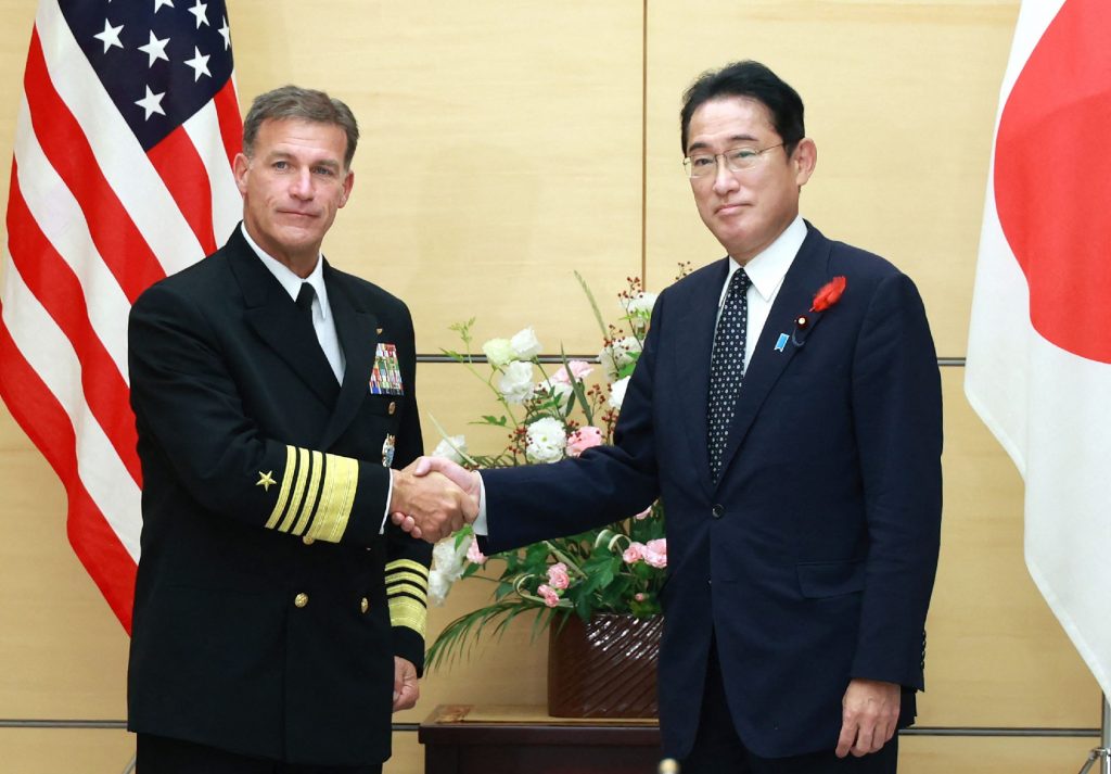 Japan's Prime Minister Fumio Kishida (R) shakes hands with Admiral John C. Aquilino, commander of the US Indo-Pacific Command, prior to their meeting at the prime minister's office in Tokyo, Oct. 4, 2022. (File/AFP)