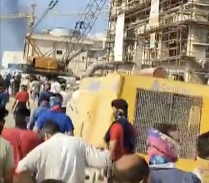 Employees of the Asaluyeh Petrochemical Refinery in Bushehr province protest and chant in Farsi “Don’t be scared, we are all together” on Monday. (Screenshot)