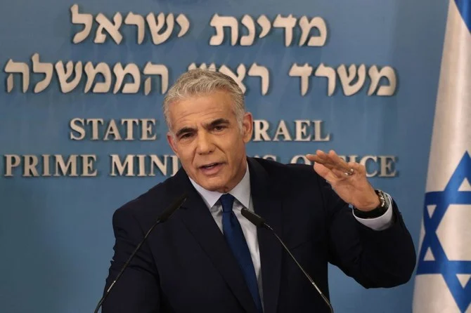 Israeli PM Yair Lapid speaks during a press conference in Jerusalem on Wednesday following the maritime agreement with Lebanon. (AFP)