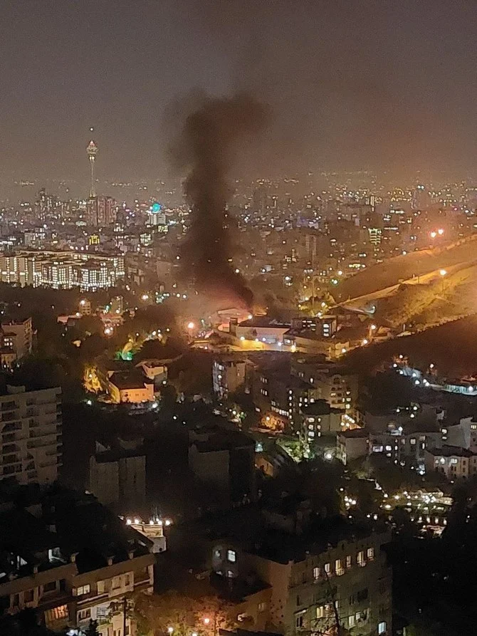 Online Iranian videos appeared to show smoke rising on Saturday from Tehran's Evin prison. (Screenshot/Social Media)