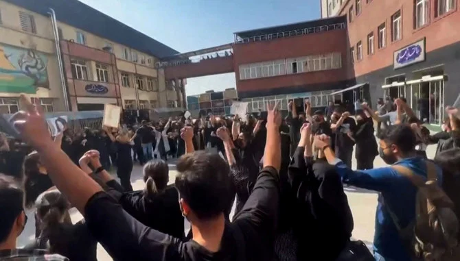 This image grab from a UGC video made available on October 15, 2022, shows Iranian students chanting 
