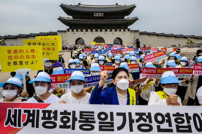 Unification Church members protest in Seoul on August 18, 2022, against Japanese media coverage linking them to the assassination in early July of former Japanese premier Shinzo Abe. (AFP)