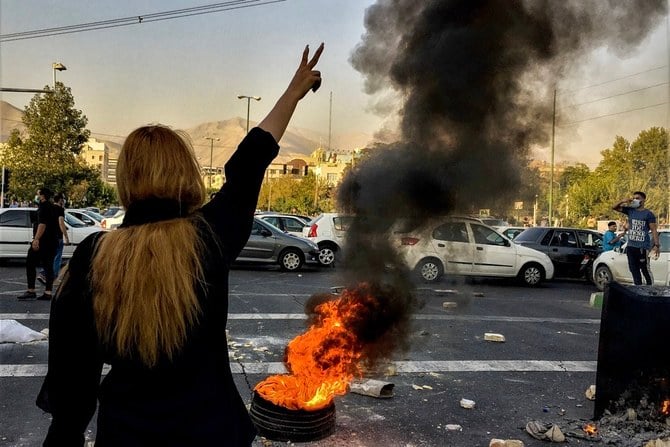 The slogans echoed those chanted in nationwide protests over Mahsa Amini, an Iranian woman of Kurdish origin who died in custody on Sept. 16. Amini, 22. (AP/File))