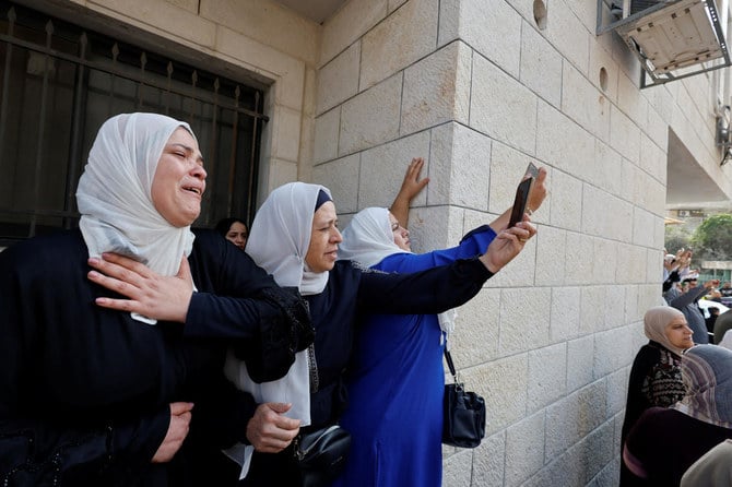 Mourners attend the funeral of Palestinian Den of Lions member Tamer Kilani, who was killed in an explosion, in Nablus in the Israeli-occupied West Bank. (Reuters)