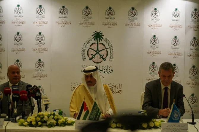 Saudi ambassador to Jordan Nayef Al-Sudairi, UNRWA’s Under-Secretary-General, Philippe Lazzarini and Dr. Ahmad Abu Holie, member of the Executive Committee of the Palestine Liberation Organization sign MoU in Amman. (Abdulrahman Shalhoub/ Arab News)