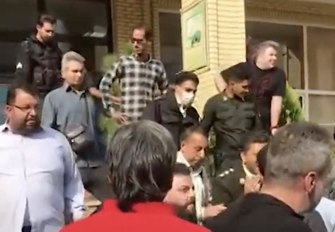 Iranian security forces reportedly using tear gas to disperse parents who had gathered in front of a school in Tehran. (Screenshot)