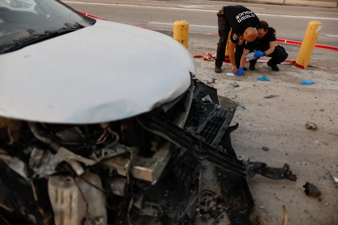 Israeli security forces at the scene of a car-ramming incident, near Jericho, in the Israeli-occupied West Bank, Oct. 30, 2022. (Reuters)