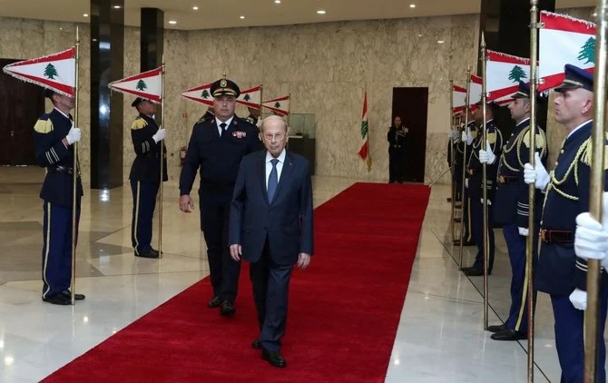 Outgoing Lebanese President Michel Aoun reviews an honor guard as he leaves the presidential palace a day before his six-year term officially ends, in Baabda, Lebanon, Oct. 30, 2022. (Reuters)