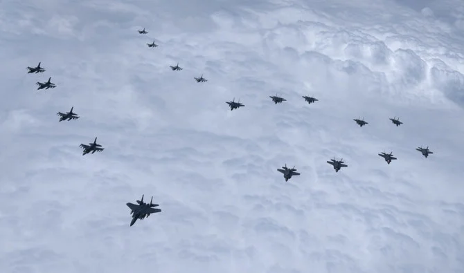 South Korean warplanes, including F-35 stealth fighters, and US F-16 jets flying in tactical formation in airspace over South Korea, in response to North Korea's missile tests on June 7, 2022. (AFP/Pool)