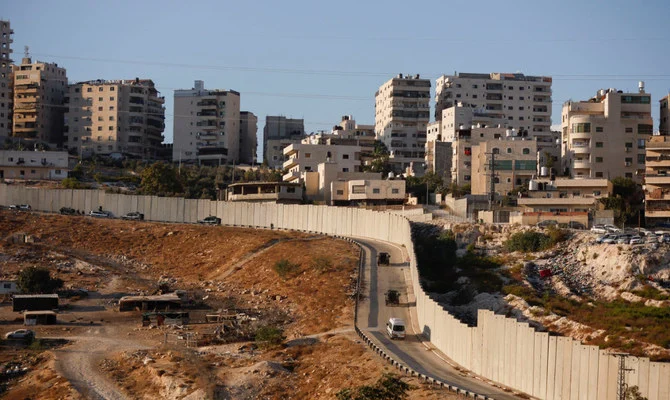 Israeli police patrol the outskirts of Shuafat refugee camp as part of a manhunt following a shooting incident at a check point in East Jerusalem October 9, 2022. (Reuters)