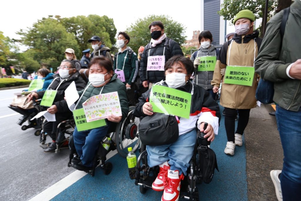 Protestors marched to parliament to demand an apology from the state as well as a guarantee to end discrimination against the disabled. (ANJ/ Pierre Boutier)