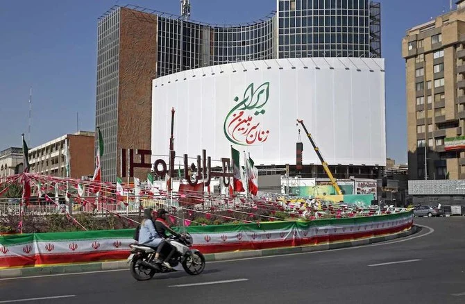 The billboard, originally showing a montage of Iranian women who all observed the hijab, was modified a day after it was raised amid women-led protests sparked by the death of Mahsa Amini. (AFP)