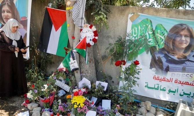 Floral tributes at the site where Shireen Abu Akleh was shot dead during an Israeli raid on Jenin, May 17, 2022. (Reuters)