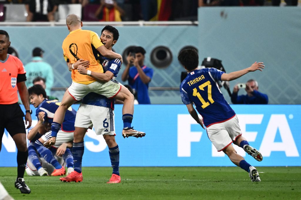 Japan's players celebrate after defeating Germany 2-1 in the Qatar 2022 World Cup Group E football match between Germany and Japan at the Khalifa International Stadium in Doha on November 23, 2022. (AFP)